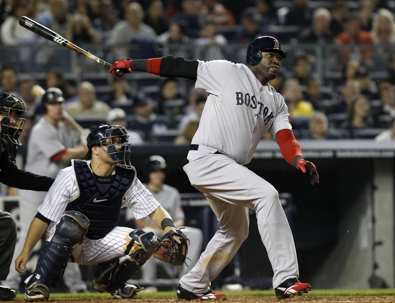 David Ortiz watches his tiebreaking home run in the fifth inning as Yankees catcher Russell Martin also looks on Sunday night at Yankee Stadium. The Red Sox beat the Yankees for the fifth time in six meetings this season.