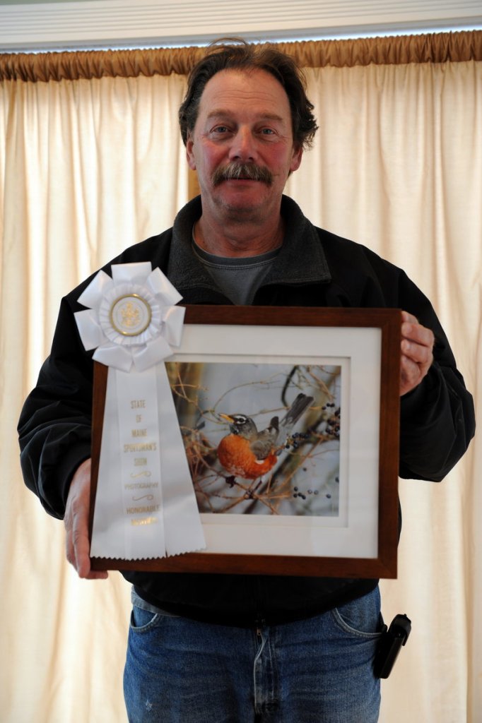 Rich Antinarelli displays "Mr. Robin Sitting Pretty," for which he received honorable mention.