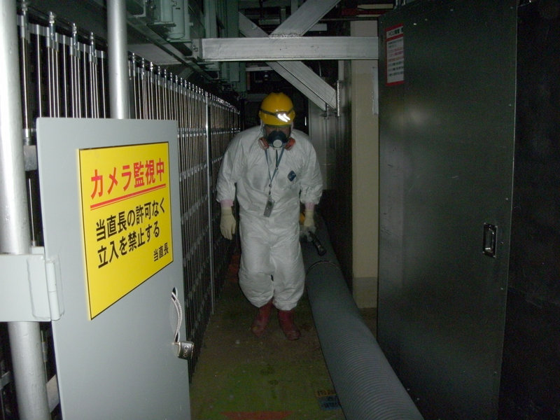 A worker walks on the first floor of the No. 1 reactor building at the Fukushima Dai-ichi nuclear power plant in Okuma, Fukushima Prefecture, northeastern Japan, early Monday.
