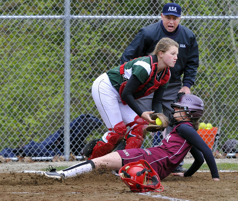 Sam Schildroth tags out Gorham’s Leaha Keene after Keene tried to score on a ball hit to McAuley third baseman Maura Ester.