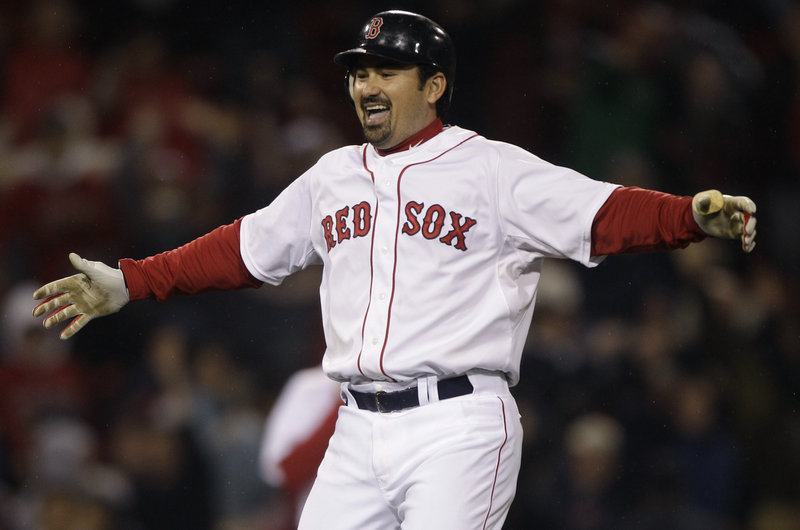 Adrian Gonzalez celebrates his two-run double in the ninth Monday night that sent the Red Sox to an 8-7 victory over the Orioles.