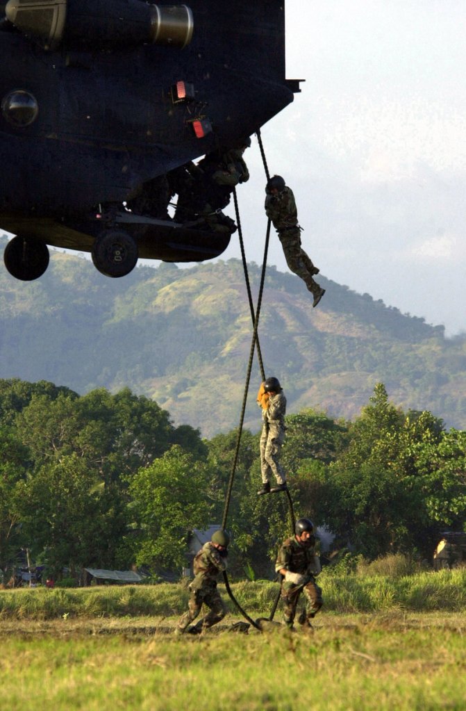 Navy SEALs help train Philippine soldiers in this 2002 file photo. Today, some falsely claim to be SEALs, which one reader says is a symptom of a wider lack of integrity.
