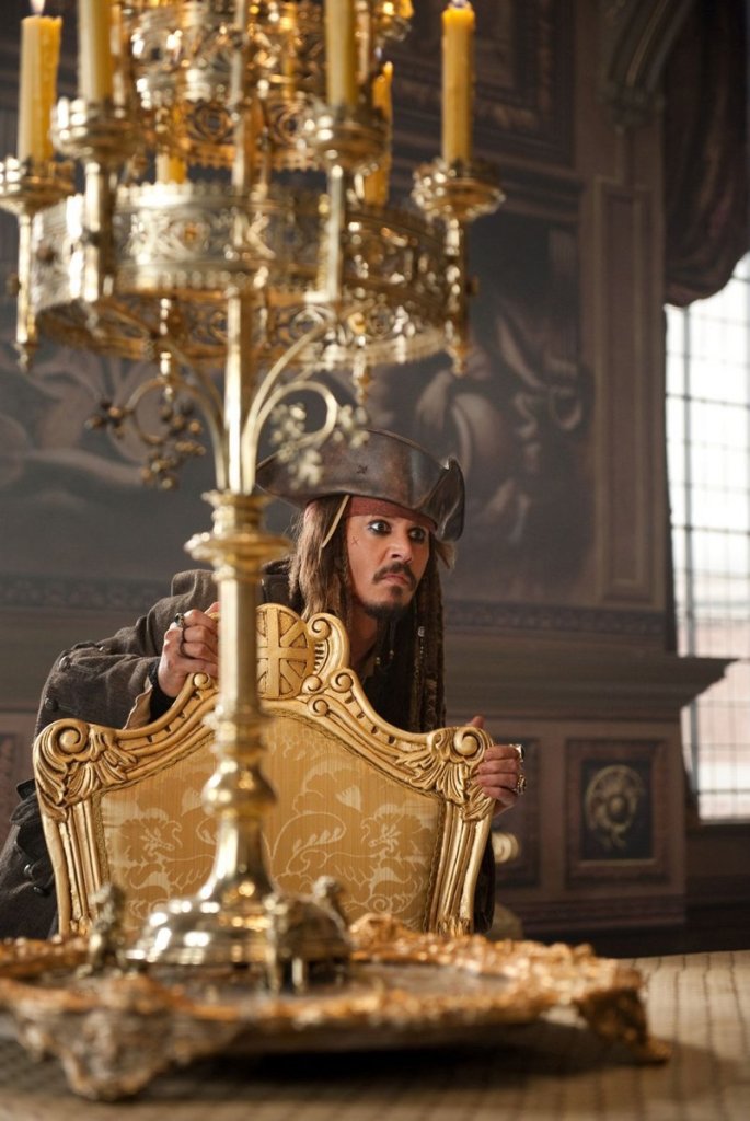 Capt. Jack Sparrow (Johnny Depp) looks out for the royal guards in the king's palace.