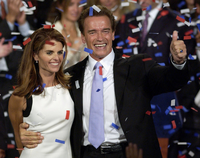 Former Gov. Arnold Schwarzenegger and his wife, Maria Shriver, celebrate his victory in the California gubernatorial recall election in Los Angeles in 2003. He has revealed that he fathered a child with a member of his household staff “over a decade ago.”