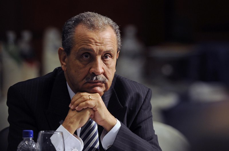 Shukri Ghanem, oil minister and head of the National Oil Co., joins the list of diplomats who have left Libya, as NATO widens its campaign of bombings and leafletting.