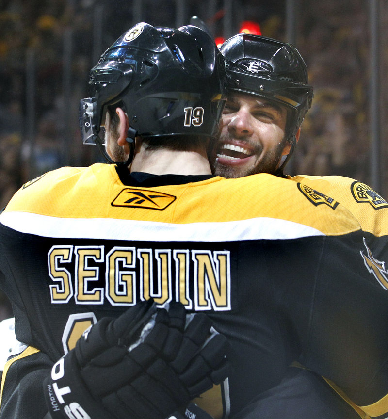 Tyler Seguin is hugged by teammate Nathan Horton after a second-period goal – one of his two Tuesday.