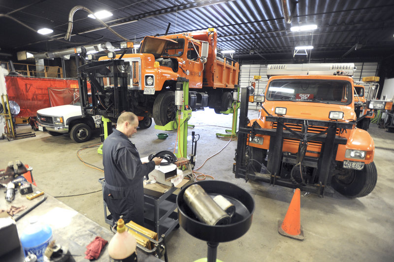Lead technician Mark Poitras works on trucks at the Westbrook Public Services Department on Thursday. The department is holding an open house Saturday to show residents how crowded its facilities are, with hopes to build a new one in 2013.