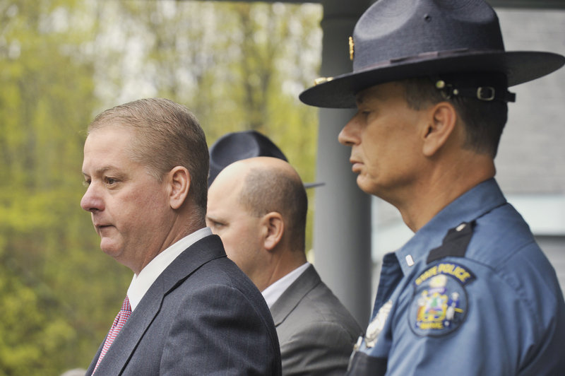 Maine State Police Lt. Brian McDonough, left, speaks to the news media Wednesday at the state police barracks in Alfred. The investigation of a young boy's death was originally a Maine case because his body was found in South Berwick, but New Hampshire prosecutors have now taken over. Maine's medical examiner will still confirm the boy's identity.