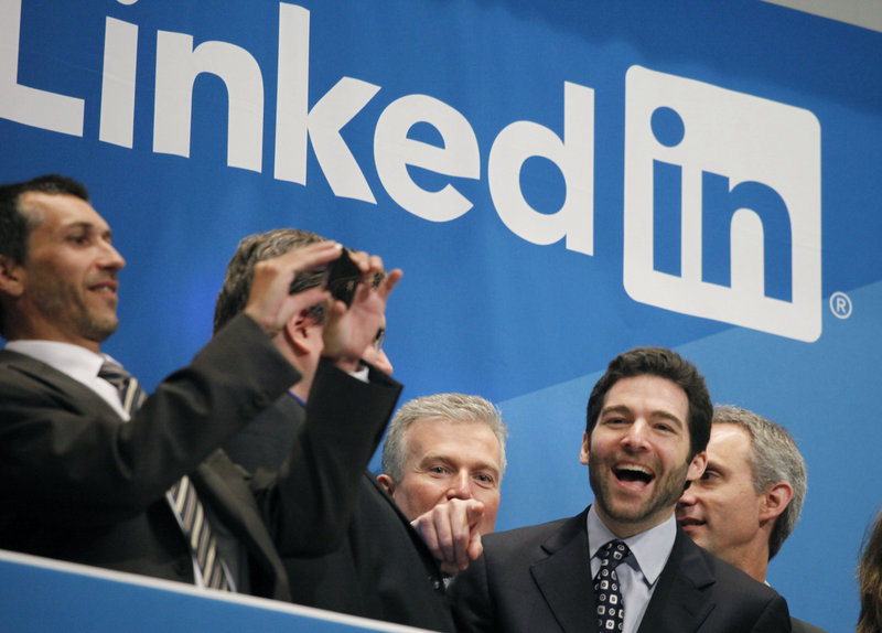 Jeff Weiner, second from right, LinkedIn’s CEO, celebrates the company’s listing Thursday at the New York Stock Exchange. LinkedIn, based in Mountain View, Calif., is an Internet-based social networking rolodex for business people.