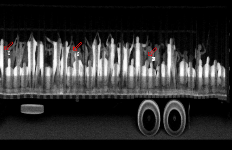 According to the Chiapas State Attorney General’s Office, this X-ray photo shows migrants being smuggled to the U.S. Two trucks that were stopped at a checkpoint in the Mexican state yielded 513 passengers.