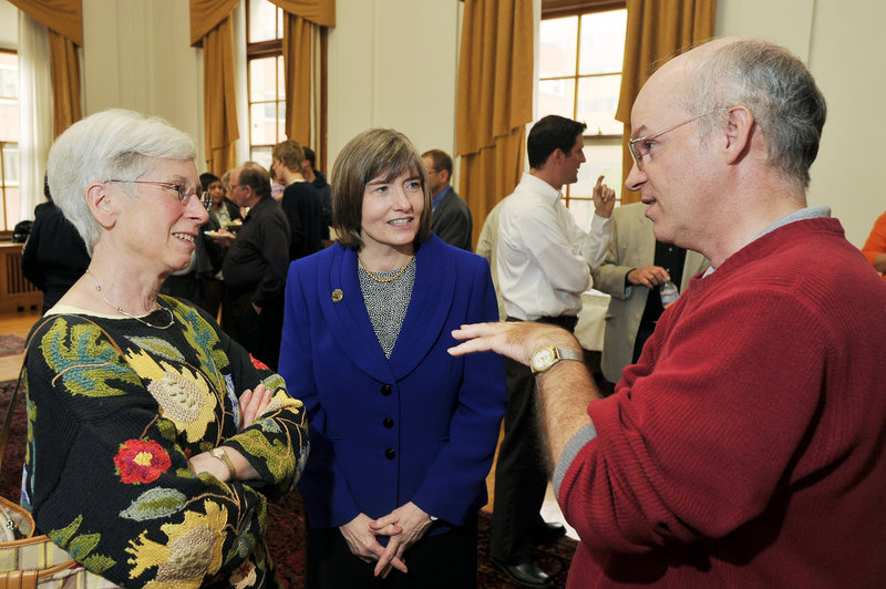 Portland’s three city manager finalists convened with the public and city officials during a reception at Portland City Hall on Friday. Patricia Finnigan, center, the acting city manager, talks with former mayor Anne Pringle, left, and resident Steven Scharf.