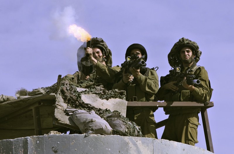 Israeli soldiers fire tear gas at Palestinian protesters at the Qalandiya checkpoint Friday. President Obama on Thursday finally uttered the words that the Palestinians had been waiting to hear for two years: that the basis for border talks with Israel is the pre-1967 war line.