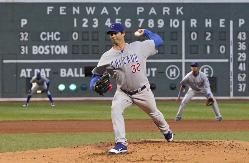 Cubs starter Doug Davis delivers a pitch Friday night in his club’s first game at Fenway Park since the 1918 World Series, which Boston won in six games.
