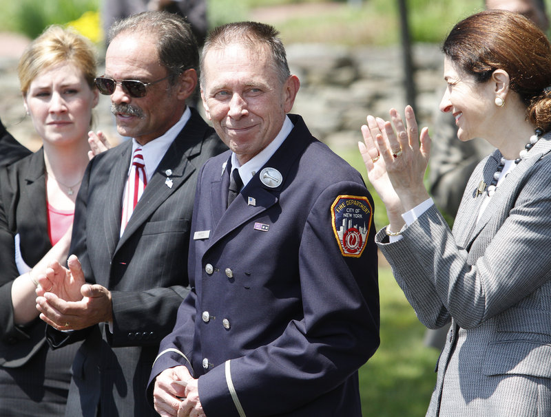 Among those speaking at Saturday's event in Freeport were Lt. Mickey Kross, left, a retired New York City firefighter, and U.S. Sen. Olympia Snowe.