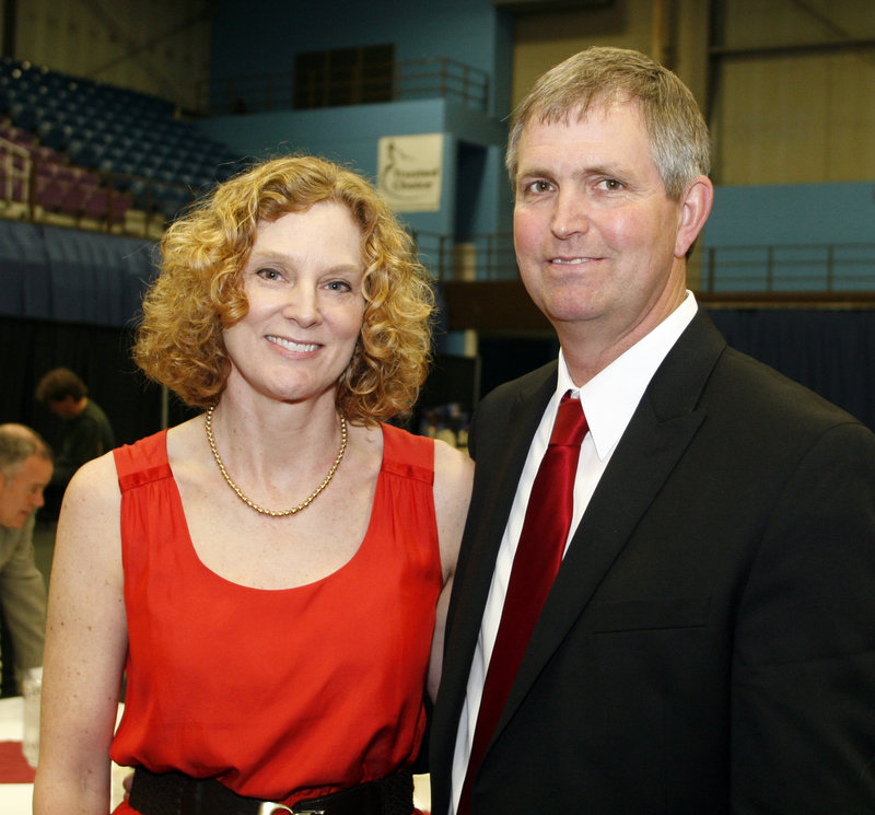 Doug Roberts, with his wife, Pam, was honored for his basketball accomplishments at Rumford High, which he led to two state titles and a New England championship.