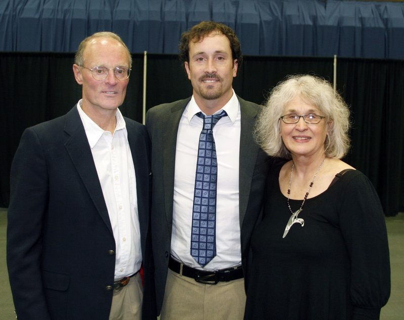 Olympic snowboardcross gold medalist Seth Wescott is flanked by his mother, Margaret, and his father, Jim, a former cross country and track and field coach at Colby College.