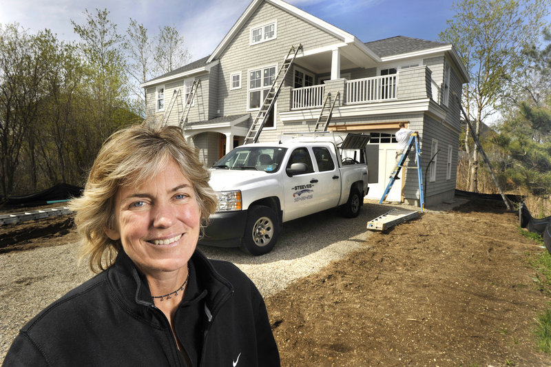 Diane Doyle, owner of Doyle Enterprises in Saco, has worked on 10 homes in a Kennebunk Beach neighborhood built on fill that is being turned into high-priced summer houses.