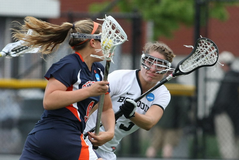 Ingrid Oelschlager of Bowdoin defends against Gettysburg's Hannah Church during the NCAA Division III women's lacrosse final Sunday at Garden City, N.Y. The Polar Bears fell short in their bid for their first NCAA title, losing 16-5.