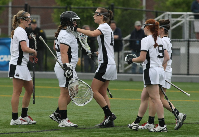 Bowdoin goalie Tara Connolly is consoled by her teammates following the Polar Bears' loss to Gettysburg in the NCAA Division III women's lacrosse championship game. The Polar Bears finished with a school-record 18 victories.