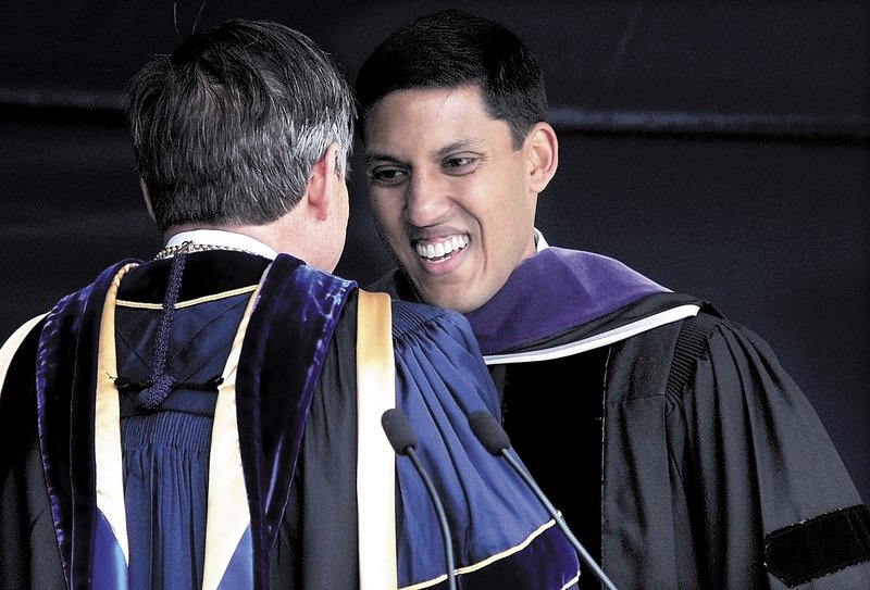 Speaker Rajiv Shah, right, is congratulated by Colby College President William Adams after Shah addressed the graduating class and received an honorary doctorate Sunday.