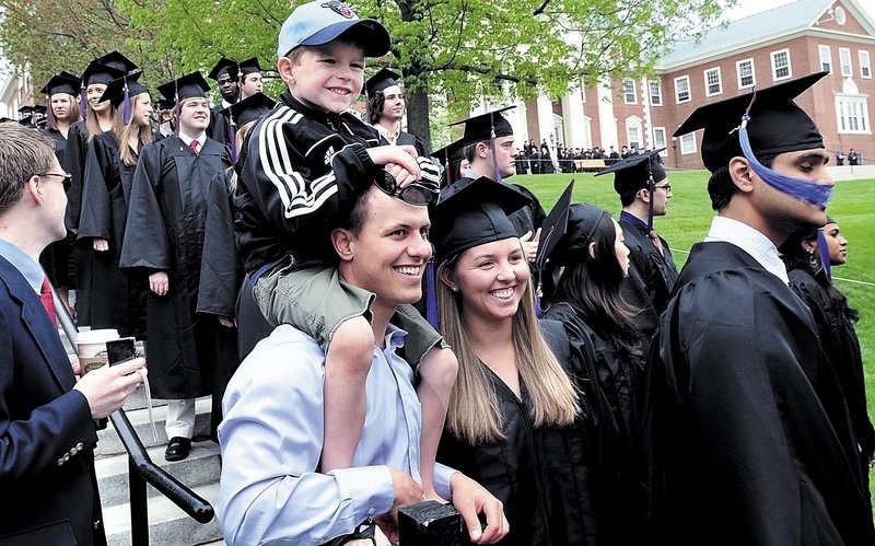 Colby College graduate Allyson Cheever of Augusta is all smiles as her boyfriend, Brett Kaptina, and nephew Andrew Cheever pose for photos in Watervillle on Sunday.
