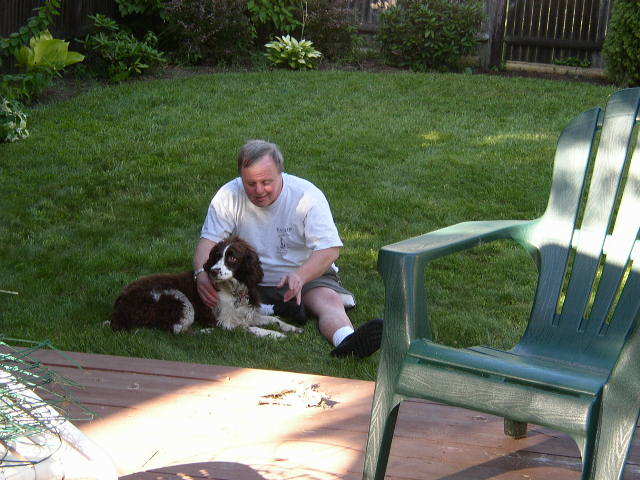 Jim Fox is shown with his springer spaniel, Molly, in his brother's backyard in South Portland in 2003.
