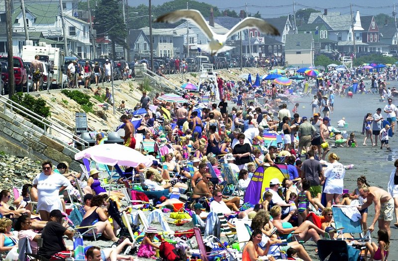 Sun lovers crowd Long Sands Beach in Cape Neddick on a hot and humid summer day.