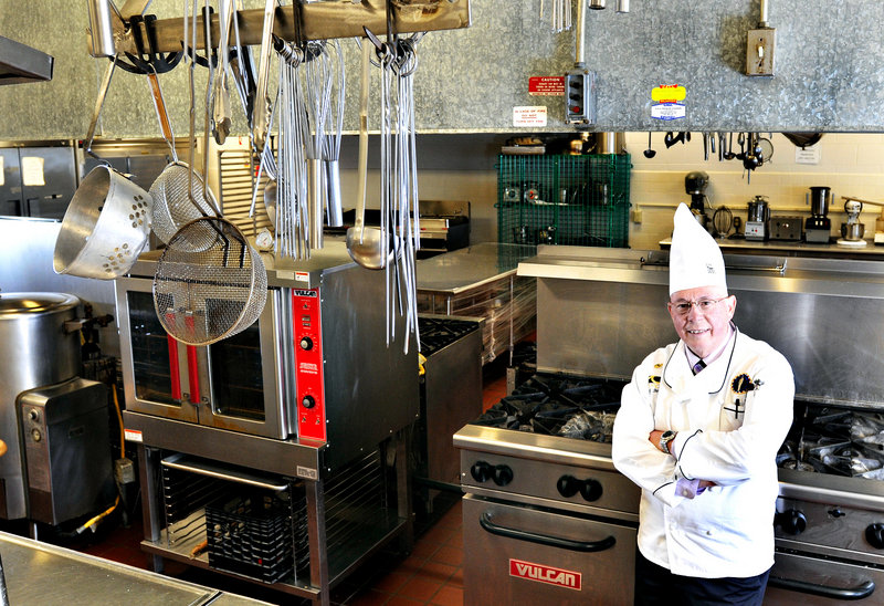 Chef Wilfred Beriau stands in the kitchen where he has taught at Southern Maine Community College for more than 25 years. Beriau is retiring, but hopes to keep a hand in the school, perhaps as a substitute teacher.