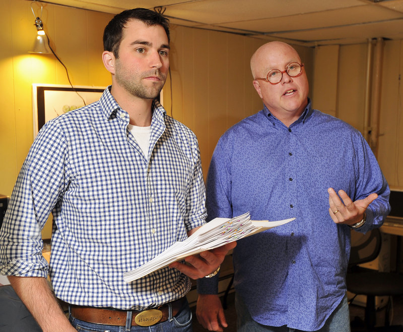 Ian Hayward, left, and Glenn Perry discuss the vote of the South Portland Planning Board on Tuesday night. Perry said he’s invested about $55,000 in a plan to build Ebo’s Market, but critics have halted the project.