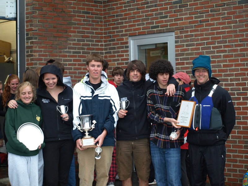 Falmouth High’s sailing team, including Haley McMahon, left, Ellie MacEwan, Charlie Lalumiere, Francesco Montanari, Myles Everett, and Coach Michael McAllister, celebrate their win at the Maine State Championship Regatta in Castine last weekend. Lalumiere and MacEwan also won the individual title for the A Division.