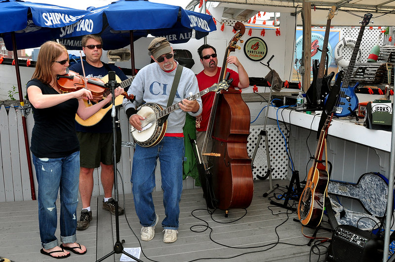 The band Jerks of Grass plays on the Portland Lobster Co. deck. The seafood restaurant in the heart of Portland's waterfront district has an extensive deck on Chandler's Wharf.