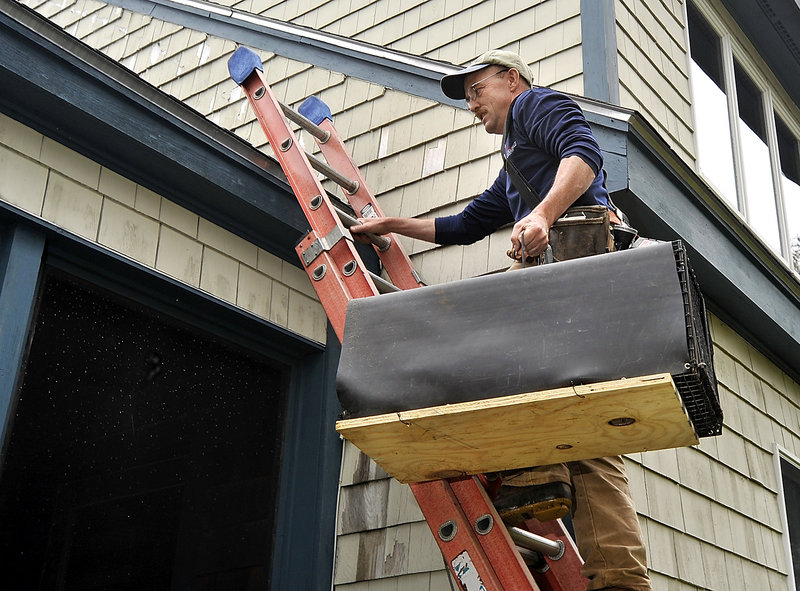 John Bourgoin was on the job in Fortune Rocks near Biddeford Pool this week, carrying a wire trap for extracting raccoons that settled in a house’s attic through a vent.