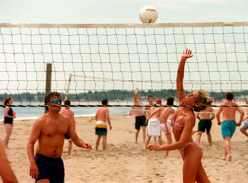 Beachgoers play volleyball at Old Orchard.