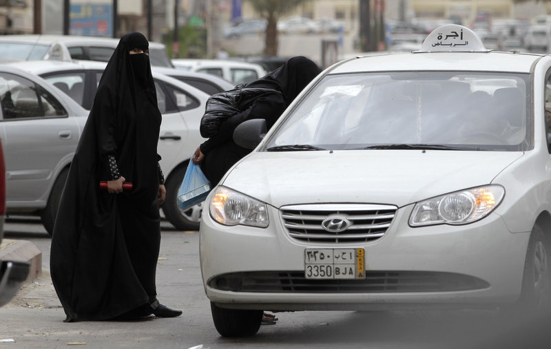 Saudi women can travel by taxi, as seen here, but a woman was arrested for a second time for driving her car in what activists say is suppression by the rulers of the conservative kingdom.