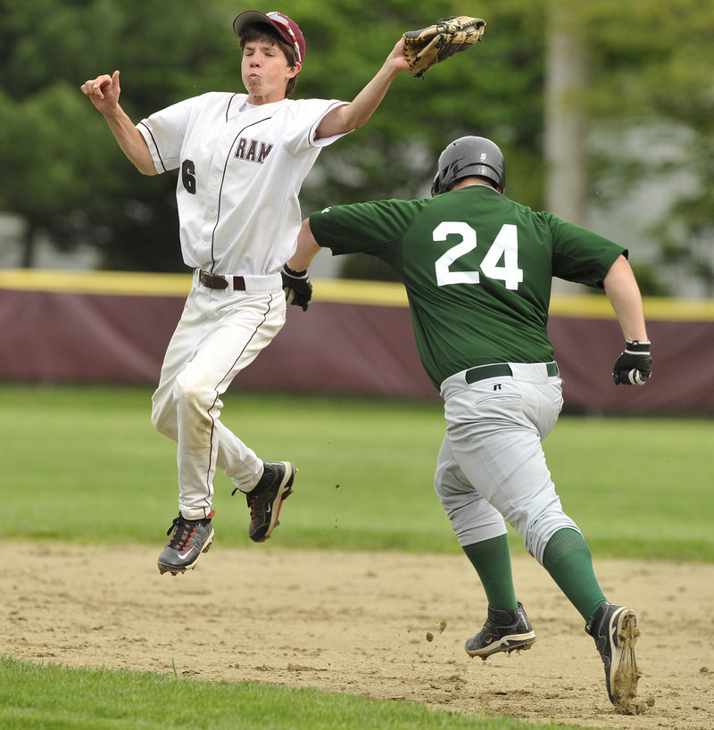 Second baseman Spencer LaPierre of Gorham snares a soft liner Tuesday as Nick Cawood of Bonny Eagle bears down on him. Bonny Eagle went on to a 17-5 victory in a Telegram League game at Gorham.