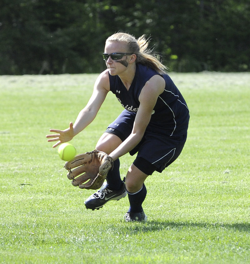 Brianna Pelkie of Fryeburg Academy races in to snare a low line drive Wednesday all part of a strong defense that helped the Raiders come away with an 11-1 victory against Lake Region.