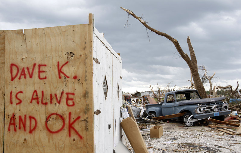 The Associated Press A reassuring message is seen on the side of a building Wednesday in Joplin, Mo.