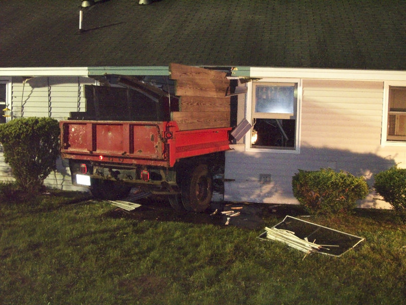 A Lovell man was charged with driving under the influence of drugs after he drove his dump truck into a home at 21 Woodland Hills in South Berwick.