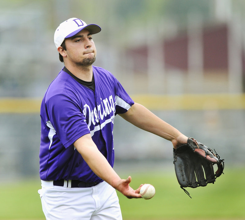 Deering pitcher Jamie Ross flips the ball to first base Thursday after coming up with a grounder during the 4-3 victory against Scarborough. Ross pitched a two-hitter and struck out 10 as the Rams improved their record to 11-2. Scarborough is 10-3.