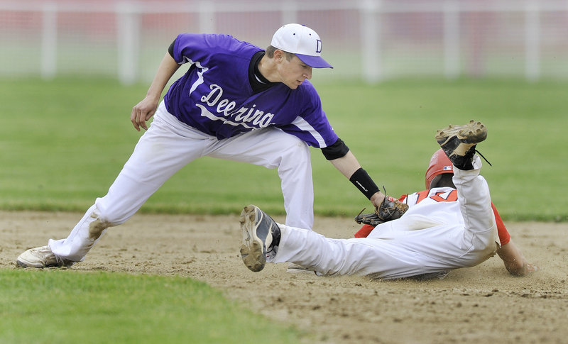 Deering second baseman Matt Bevilacqua applies the tag as Ryan Mancini of Scarborough is caught attempting to steal.
