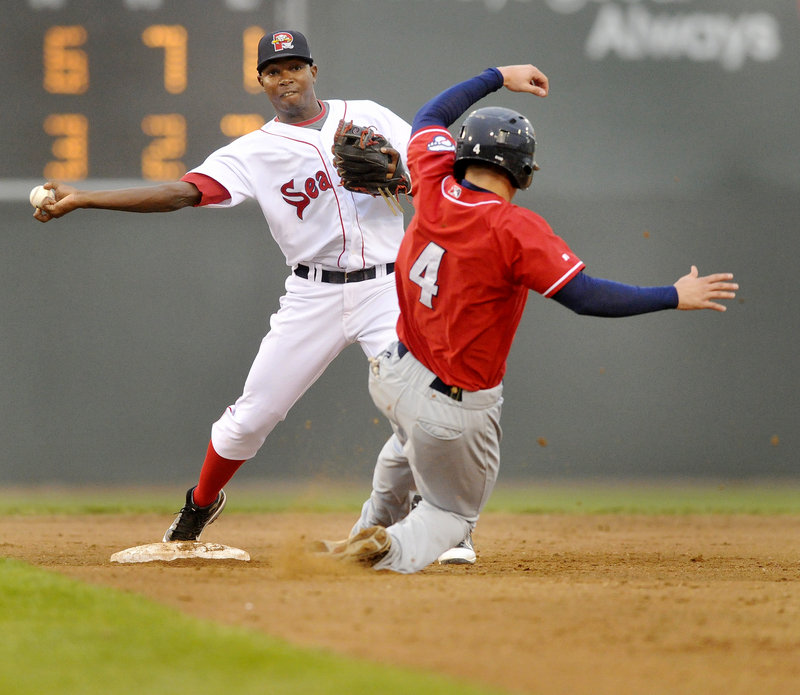 Second baseman Oscar Tejada throws to first after forcing Mark Sobolewski of New Hampshire in the fifth inning of the Sea Dogs’ 13-7 loss Thursday night at Hadlock Field.
