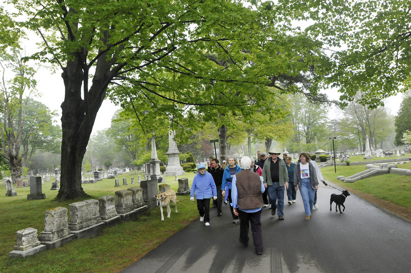 Janet Morelli leads a Civil War walking tour Saturday at Evergreen Cemetery in Portland as part of the 20th anniversary celebration of the Friends of Evergreen, a nonprofit caretaker organization. The 159-year-old cemetery was modeled after Mount Auburn Cemetery in Cambridge, Mass.