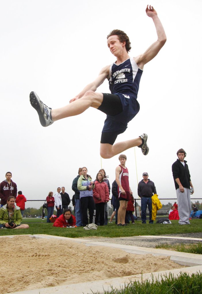 Asa Arden of Yarmouth gives his best effort in the triple jump. Jack Peters of Gray-New Gloucester won the event with a distance of 42-5 3/4.