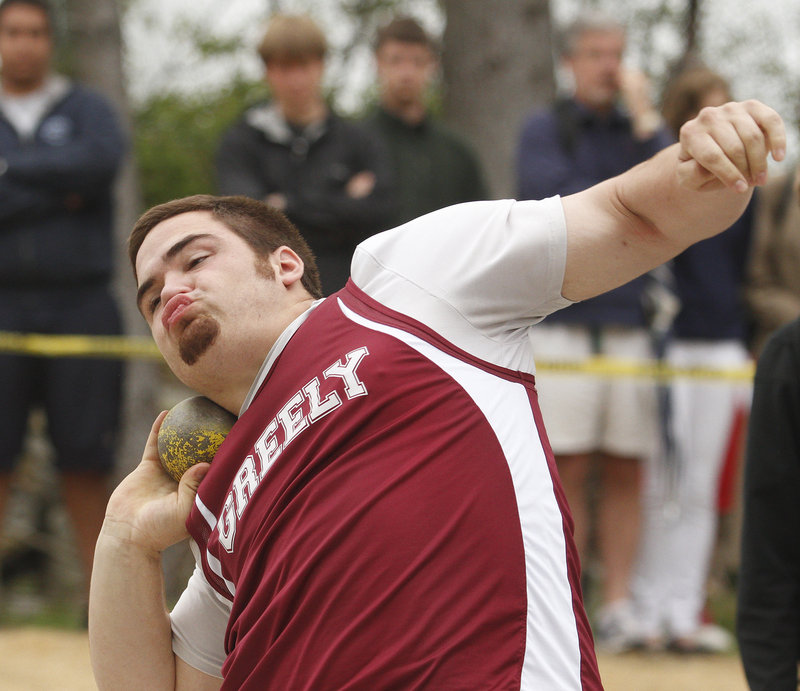 Michael Burgess of Greely, the boys' top large-school athlete in field events, unleashes a throw of 55 feet, 3 1/2 inches in the shot put to set the only new conference record of the day.