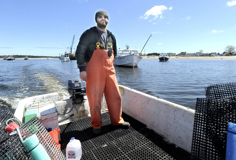 Nate Perry is growing oysters on the Scarborough River.