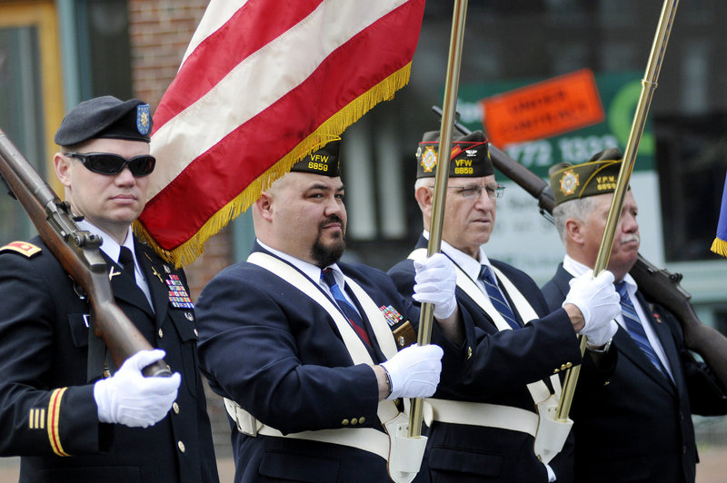 Members of Veterans of Foreign Wars Post 6859 in Portland from left, Todd Mitchell, Steve San Pedro, Bob Bernard and Rick Cobb, prepare to march in the parade. The VFW post's chaplain, the Rev. Bill Doughty, was grand marshal of Monday's parade.