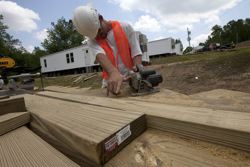 Anthony Massie of Lexington, Tenn., works to install FEMA trailers for tornado victims in Phil Campbell, Ala., on May 9. Nearly a third of the city of Joplin, Mo., was damaged by a tornado May 22. FEMA said it will consider bringing in trailers if enough homes are not available.
