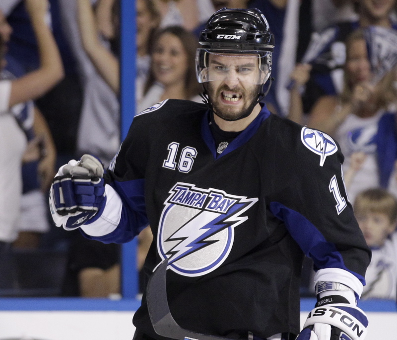 Teddy Purcell of Tampa Bay, a former UMaine player, celebrates a goal today in Game 4 of the Eastern Conference finals at St. Petersburg, Fla. The Lightning rallied from a three-goal deficit to win 5-3, tying the series, 2-2. Purcell had two goals in the second period.