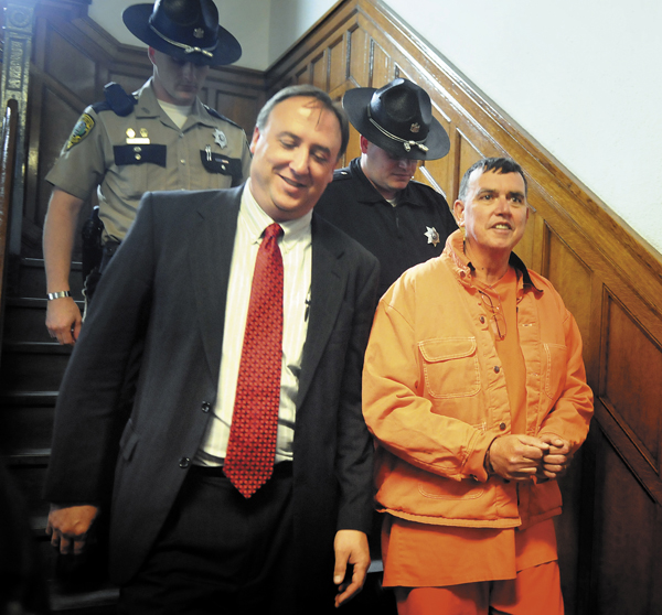 Maine Rep. Frederick Wintle, R-Garland, is escorted back to Kennebec County Jail on Monday after a hearing at Kennebec County Superior Court in Augusta.