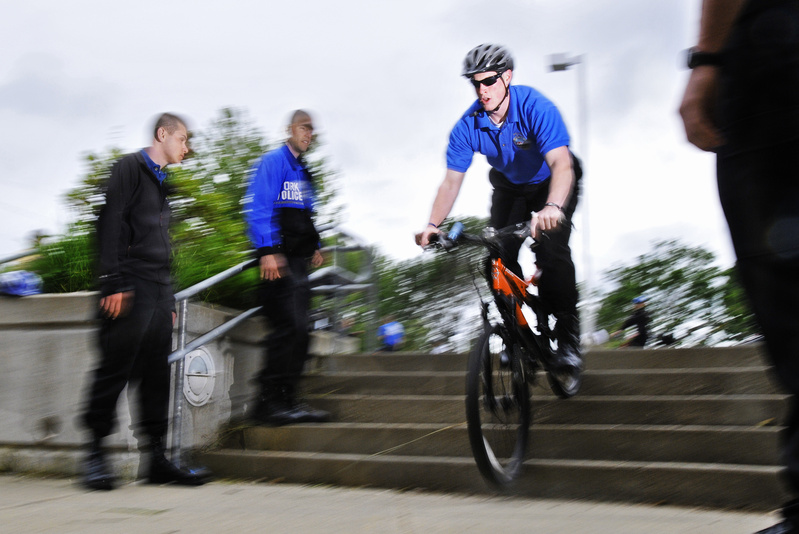Ben Mitchell, a new reserve officer for the York Police Department, participates in a drill Tuesday at York Middle School designed to help officers ride their mountain bikes down stairs while chasing a suspect.